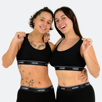 Chas wears a size S, Michela wears a size L